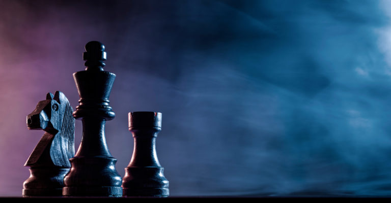 Chess pieces on a dark background